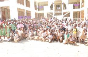 Jubilant pupils in a pose with the Bishop